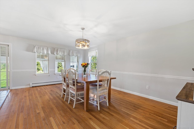 6 Margaret Cir, Pomfret, CT 06259 - dining room featuring baseboards, an inviting chandelier, wood finished floors, and a baseboard radiator