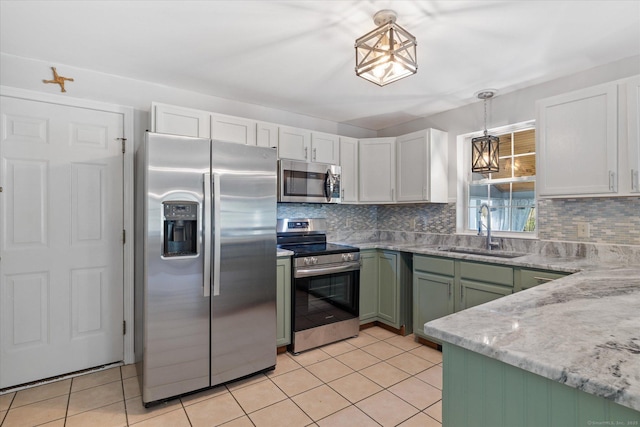 6 Margaret Cir, Pomfret, CT 06259 - kitchen featuring appliances with stainless steel finishes, decorative backsplash, a sink, and green cabinets