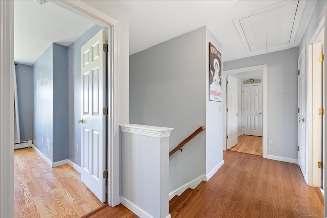 6 Margaret Cir, Pomfret, CT 06259 - hallway with an upstairs landing, light wood-style flooring, attic access, and a baseboard radiator