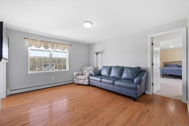 6 Margaret Cir, Pomfret, CT 06259 - living room with light wood-type flooring and a baseboard radiator