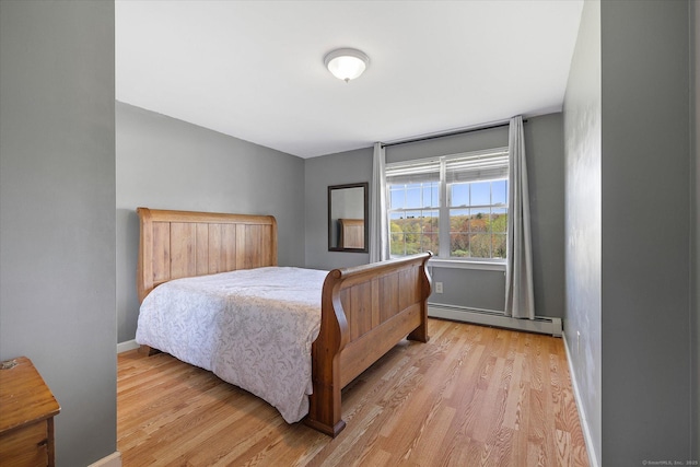 6 Margaret Cir, Pomfret, CT 06259 - bedroom featuring baseboards, light wood-style flooring, and a baseboard radiator