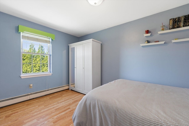 6 Margaret Cir, Pomfret, CT 06259 - bedroom with a baseboard heating unit and wood finished floors