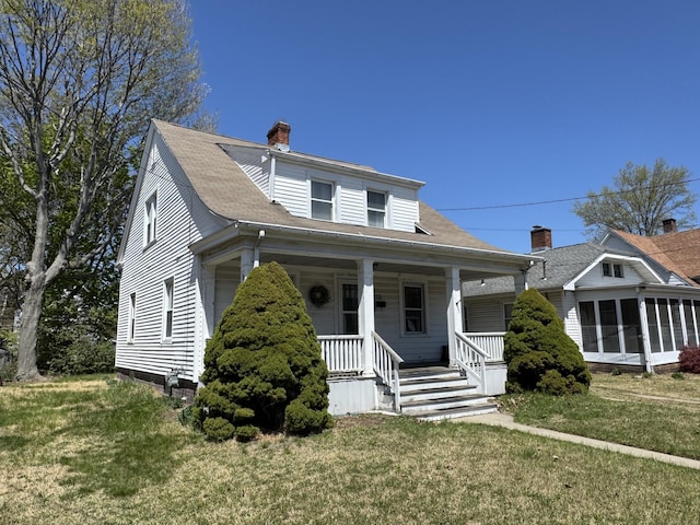 33 E Brown St, West Haven, CT 06516 - bungalow-style house with a sunroom, a front yard, a chimney, and covered porch