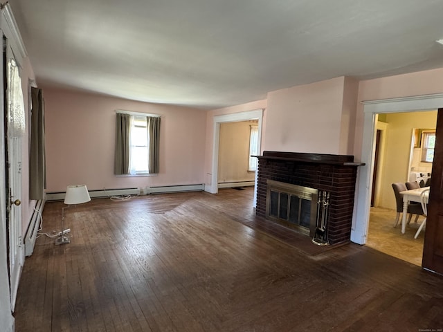 33 E Brown St, West Haven, CT 06516 - unfurnished living room featuring a baseboard radiator, a brick fireplace, baseboard heating, and hardwood / wood-style flooring