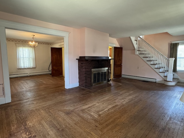 33 E Brown St, West Haven, CT 06516 - unfurnished living room with an inviting chandelier, baseboard heating, a baseboard heating unit, and a healthy amount of sunlight