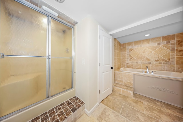 bathroom featuring stone finish floor, a garden tub, a stall shower, baseboards, and recessed lighting