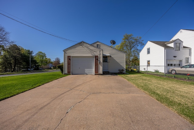 view of side of home with a yard, fence, concrete driveway, and a garage