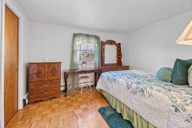 bedroom with a baseboard heating unit and baseboard heating