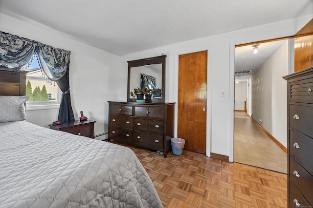 bedroom with baseboards, visible vents, and a baseboard radiator