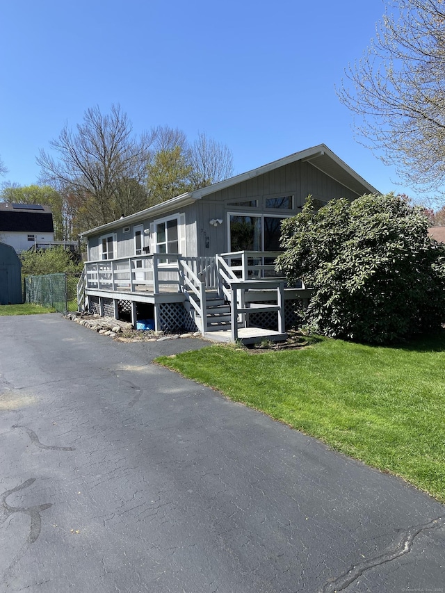 20 Connecticut Dr, Plainfield, CT 06374 - view of front of house with a deck and a front yard
