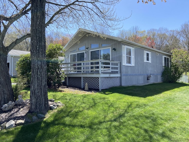 20 Connecticut Dr, Plainfield, CT 06374 - rear view of property with a deck and a yard