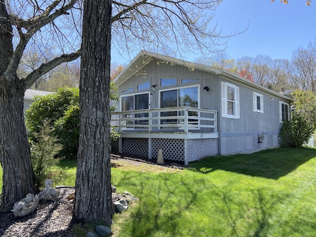 20 Connecticut Dr, Plainfield, CT 06374 - view of property exterior with a deck and a yard