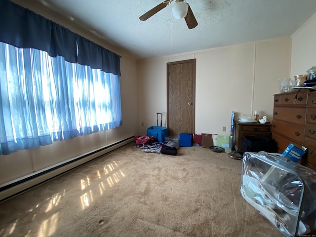 20 Connecticut Dr, Plainfield, CT 06374 - unfurnished bedroom with a baseboard radiator, carpet floors, a textured ceiling, and ceiling fan