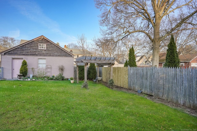 view of yard with fence and a pergola