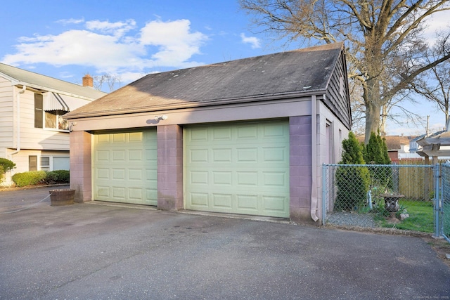 detached garage with fence