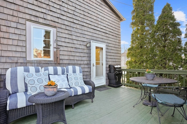 wooden deck featuring grilling area