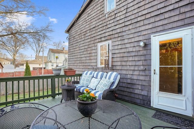 wooden deck featuring fence and outdoor dining area