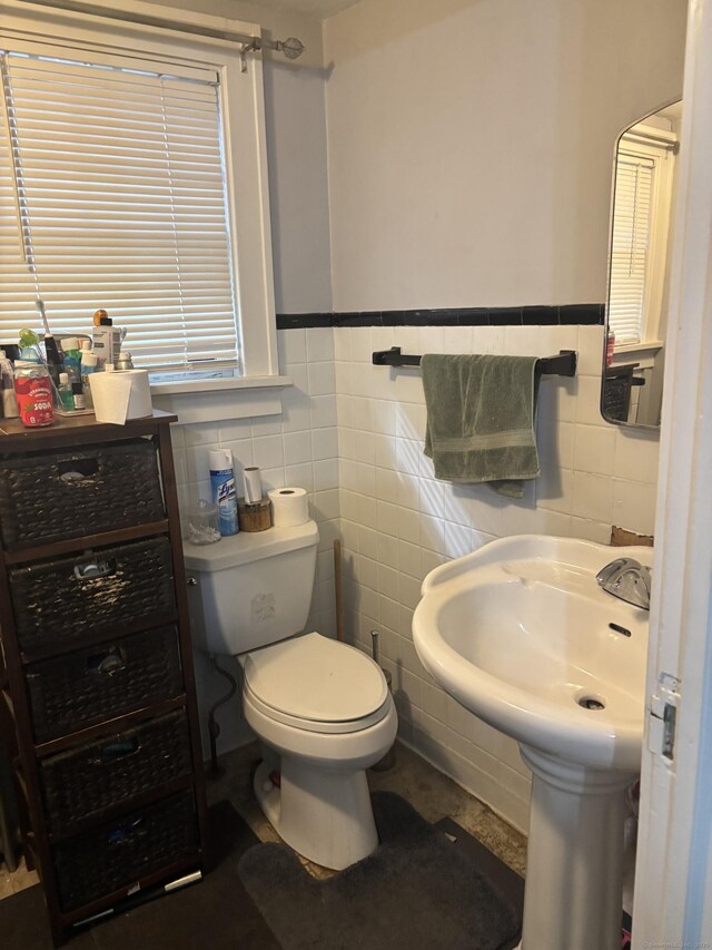 45 Ivy St, Branford, CT 06405 - bathroom featuring toilet, wainscoting, and tile walls