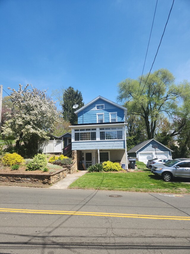 45 Ivy St, Branford, CT 06405 - view of front of house with a garage and a front yard