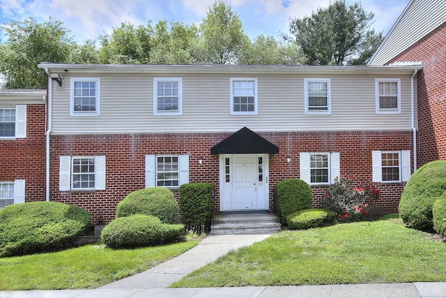 50 Greenhouse Rd Unit 17A, Bridgeport, CT 06606 - view of front of house with brick siding and a front lawn