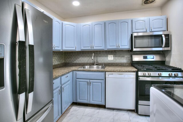 50 Greenhouse Rd Unit 17A, Bridgeport, CT 06606 - kitchen with appliances with stainless steel finishes, a sink, dark countertops, and decorative backsplash