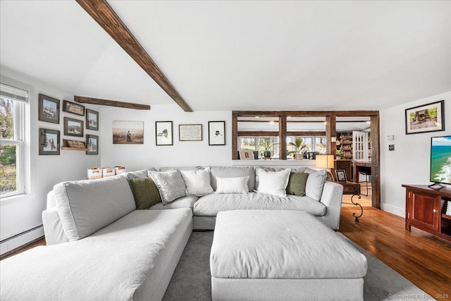 living area featuring a fireplace, baseboards, wood finished floors, beamed ceiling, and a baseboard heating unit