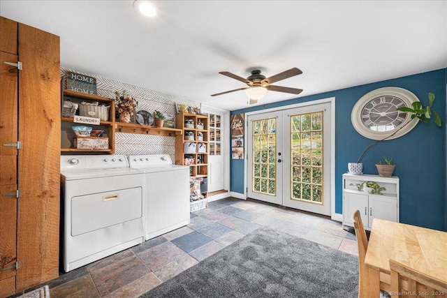 washroom featuring laundry area, french doors, a ceiling fan, washing machine and dryer, and stone tile flooring