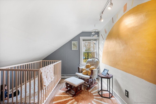 bonus room featuring baseboards and vaulted ceiling