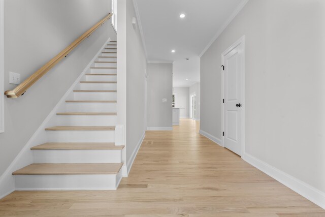 93 Wyoming St, Stratford, CT 06614 - staircase with ornamental molding, recessed lighting, wood finished floors, and baseboards