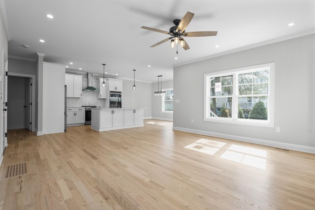 93 Wyoming St, Stratford, CT 06614 - unfurnished living room featuring recessed lighting, ornamental molding, light wood-type flooring, ceiling fan, and baseboards