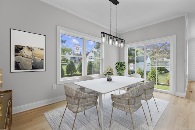 93 Wyoming St, Stratford, CT 06614 - dining space featuring light wood-style floors, baseboards, healthy amount of natural light, and crown molding
