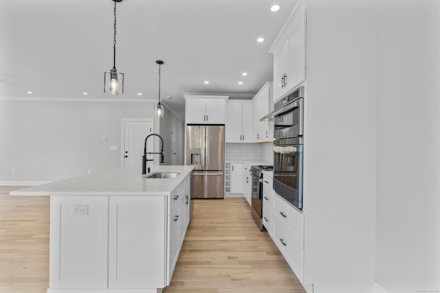 93 Wyoming St, Stratford, CT 06614 - kitchen with stainless steel appliances, a sink, light countertops, backsplash, and recessed lighting