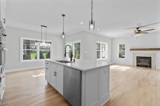 93 Wyoming St, Stratford, CT 06614 - kitchen with a sink, dishwasher, plenty of natural light, light wood-style flooring, and recessed lighting