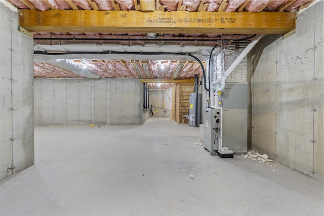93 Wyoming St, Stratford, CT 06614 - unfinished basement featuring water heater and heating unit