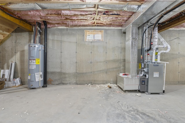 93 Wyoming St, Stratford, CT 06614 - basement featuring electric water heater and heating unit