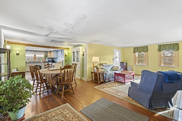living room with baseboards and wood finished floors