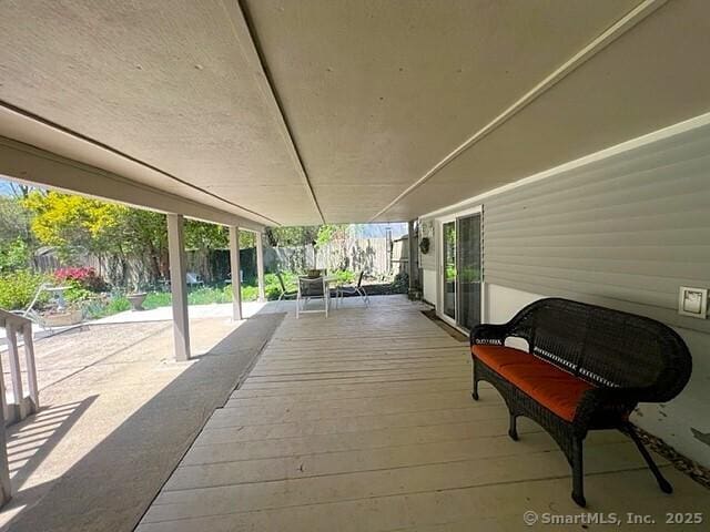 view of patio with a fenced backyard and a wooden deck