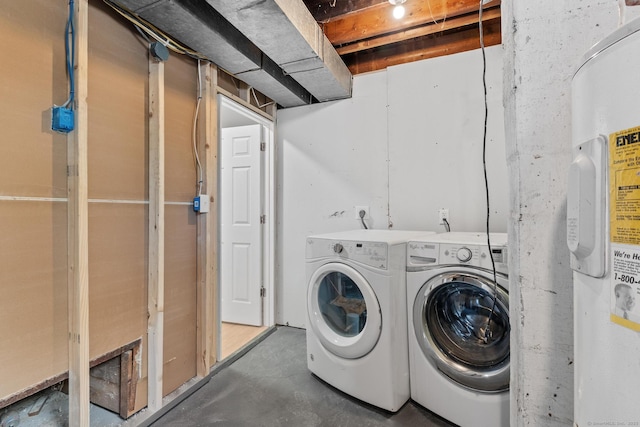 laundry room with washing machine and clothes dryer and laundry area