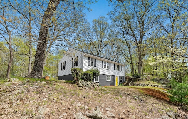 view of front of property featuring stairway
