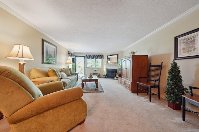 living area with a fireplace, ornamental molding, light carpet, and a textured ceiling