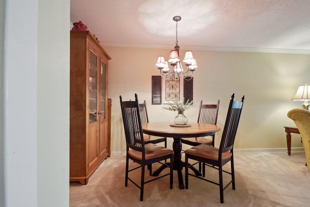 dining area featuring crown molding, baseboards, light colored carpet, and a notable chandelier