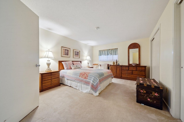 bedroom featuring radiator and light carpet