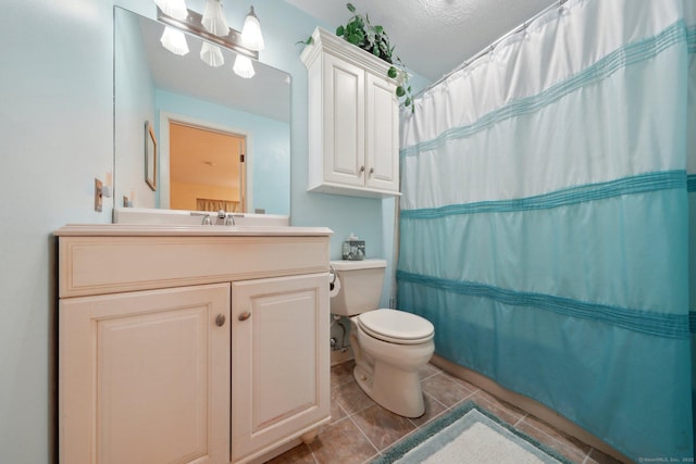 bathroom with toilet, a shower with shower curtain, tile patterned flooring, and vanity