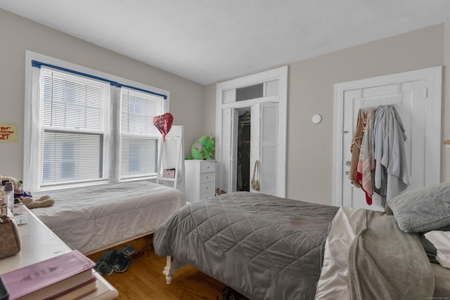 bedroom featuring wood finished floors