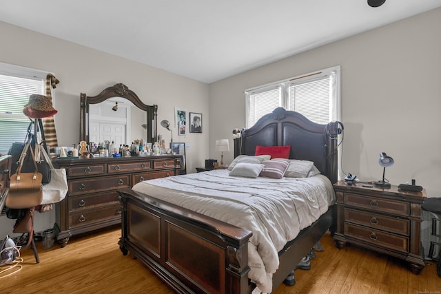 bedroom featuring light wood-style flooring