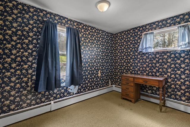empty room with a baseboard heating unit and wallpapered walls