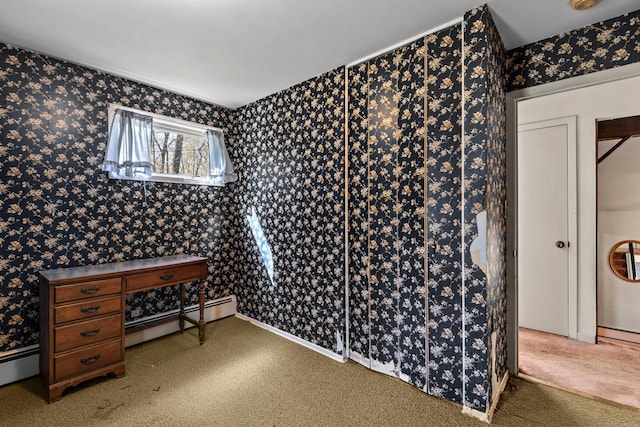 interior space featuring carpet flooring, wallpapered walls, and a baseboard heating unit