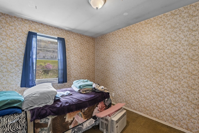 bedroom with carpet floors, baseboards, and wallpapered walls