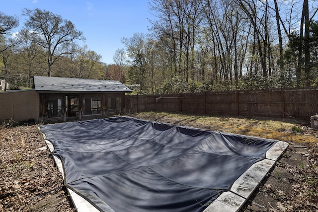 view of swimming pool featuring a fenced backyard