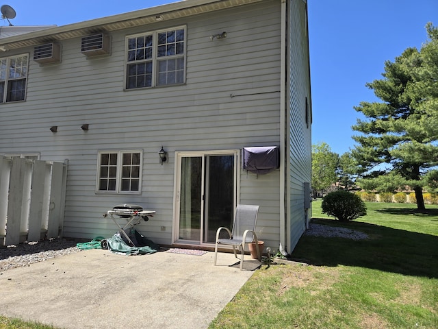back of house featuring a lawn, fence, and a patio area